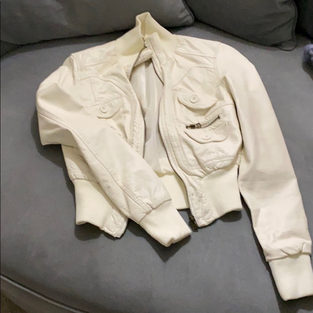 Cream colored bomber style jacket